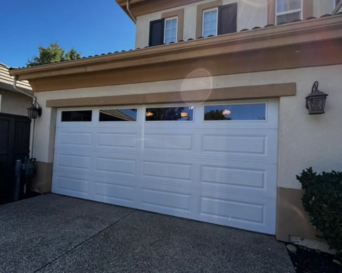 White sectional garage door on a residential home