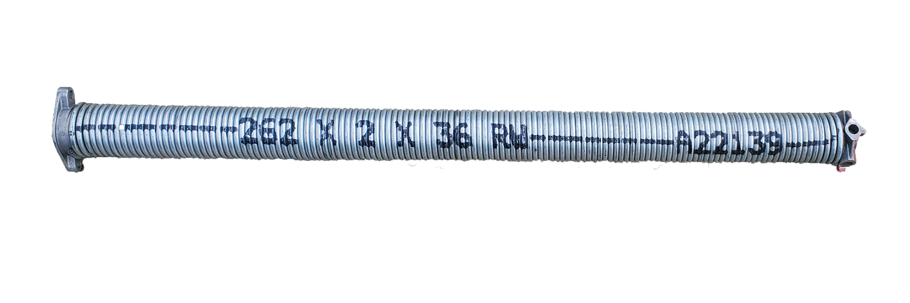 Real photograph of a garage-door torsion spring shown separately from a door.